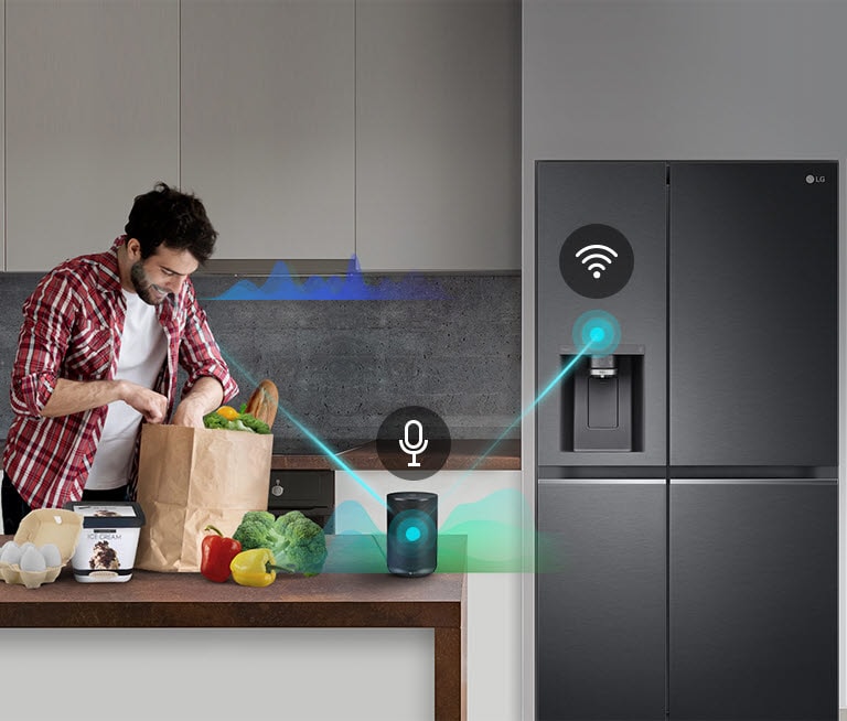 Person unpacking groceries in a modern kitchen with a smart speaker on the counter and an LG black refrigerator nearby.