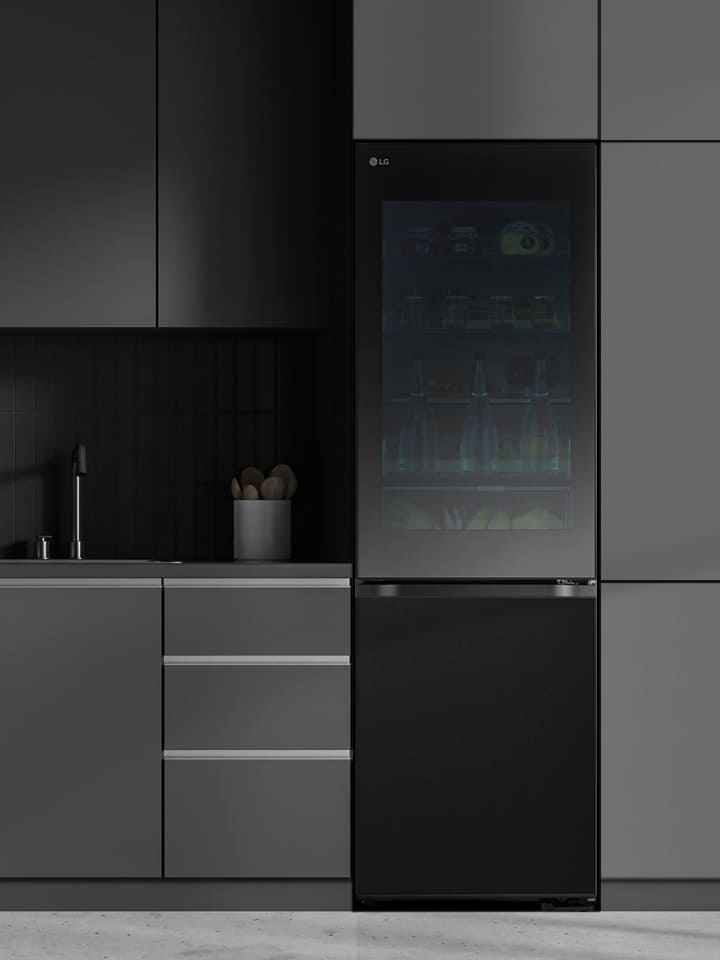 Modern kitchen with a refrigerator that blends seamlessly into surrounding cabinetry, resembling a built-in model.