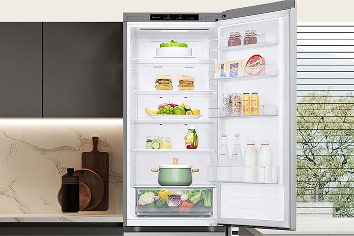 Fresh food-filled refrigerator with open door showcasing wine rack and folding shelf.