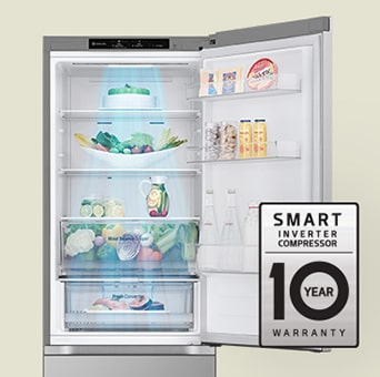 Fresh food-filled refrigerator with open door and 10-year warranty label of smart inverter compressor.