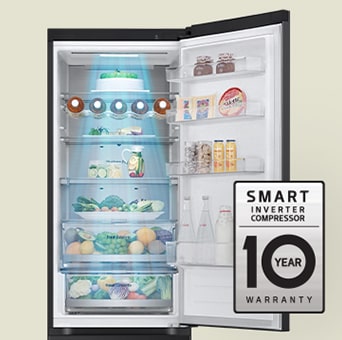 Fresh food-filled refrigerator with open door and 10-year warranty label of smart inverter compressor.