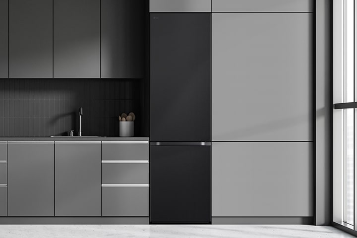 Modern kitchen with a refrigerator that blends seamlessly into surrounding cabinetry, resembling a built-in model.