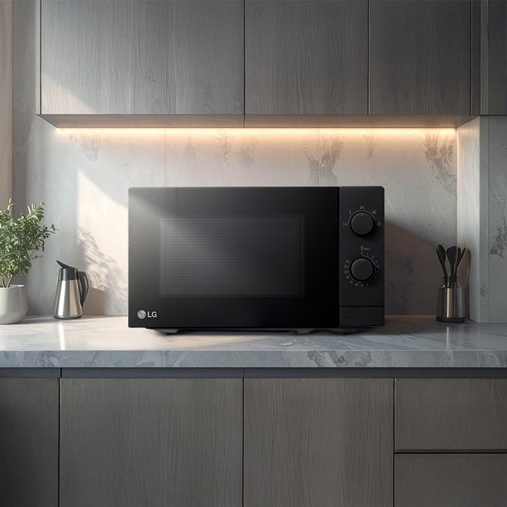 LG microwave in a modern kitchen with sleek glass-front door design