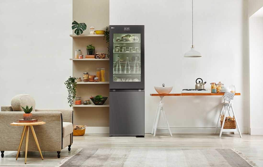 An image of a refrigerator placed in a living room with a cute interior.