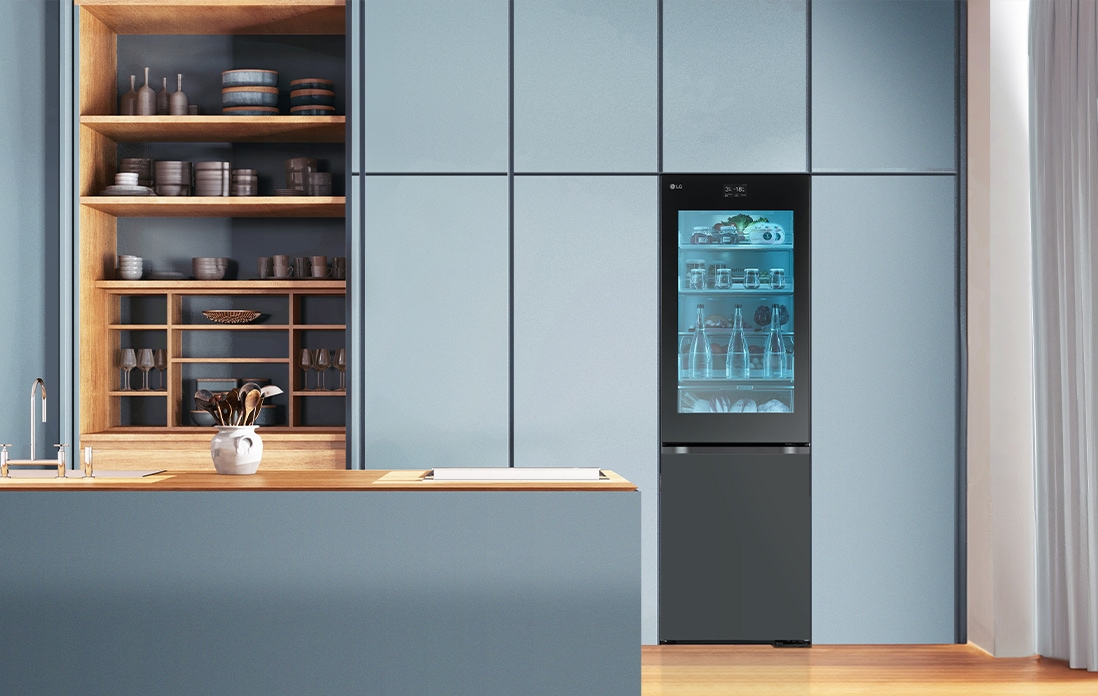 An image of a refrigerator placed in a blue-toned kitchen.