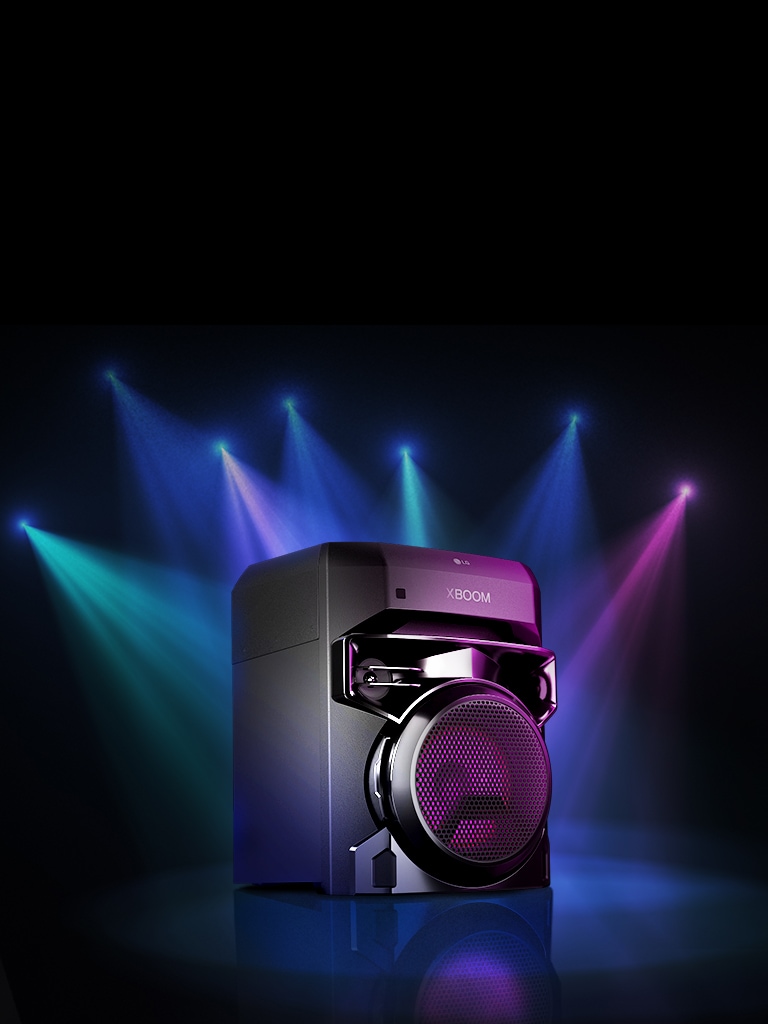 Left 30 degree view of LG XBOOM XL2S spotlighted on the stage. The XBOOM light are also purple.