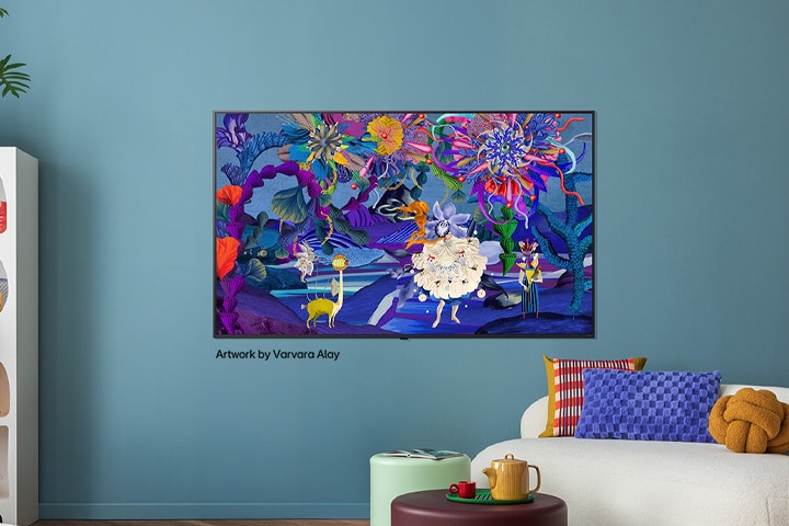 Interior of a stylish and colorful home. An LG TV is mounted on the wall. On its screen is a colorful modern artwork. The illustration on the TV adds personality to the overall interior design of the space.