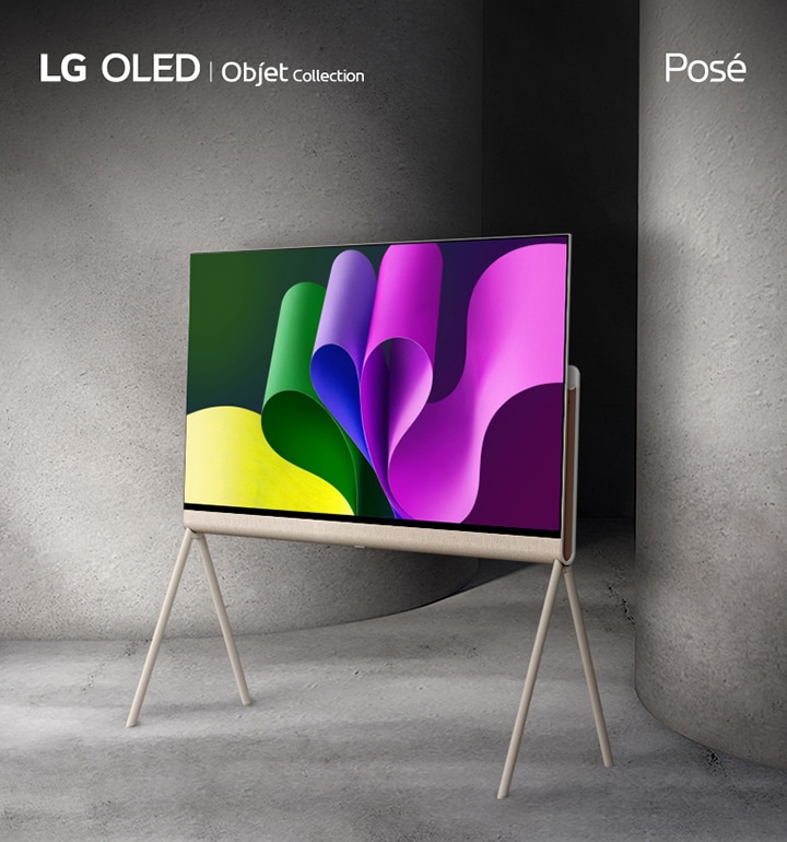 LG OLED Posé seen from the back. The camera zooms in as LG OLED Posé rotates left, slowing down for a close-up of the LG Objet logo and view from the side. Posé finishes at a 45-degree angle facing left with colourful abstract artwork on-screen as it’s placed between two large gray columns.