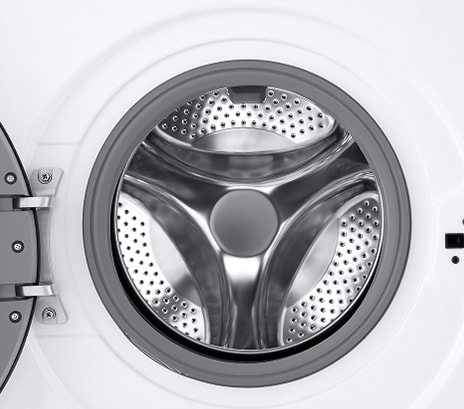 Close-up of the washing machine drum with the door open