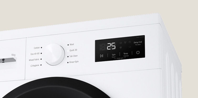 Close-up of the washing machine dial and panel