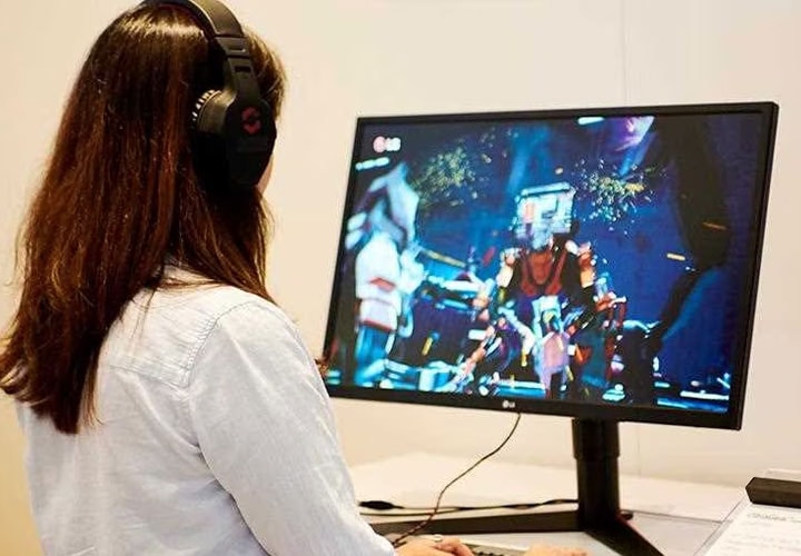 IFA 2018: A woman plays a video game on the LG 27GK750F Monitor, on show in the gaming section of the exhibition