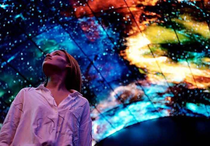 A photo of capturing a woman mesmerised by lg oled tunnel at berlin ifa 2017.