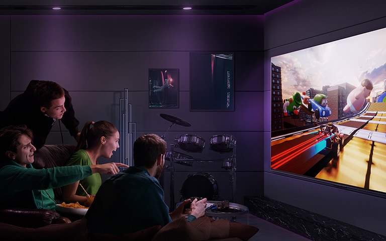 People are playing a racing game on a LG OLED TV