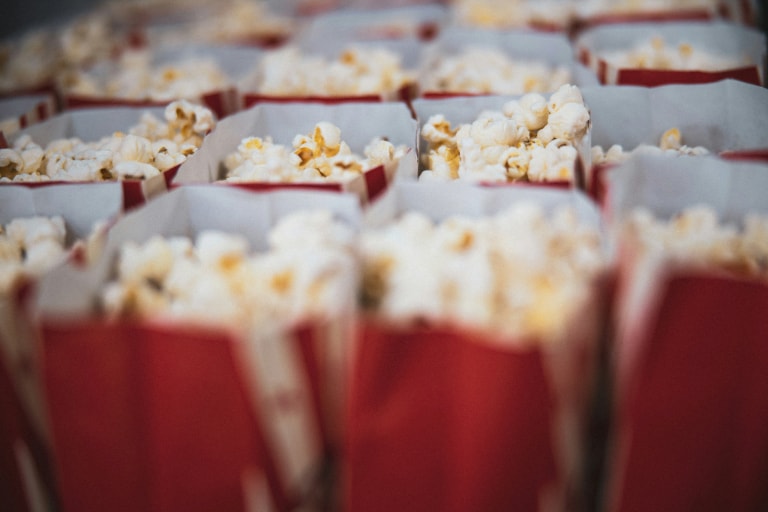 Elevate family movie nights with top-notch home cinema tech and popcorn for an unforgettable experience.