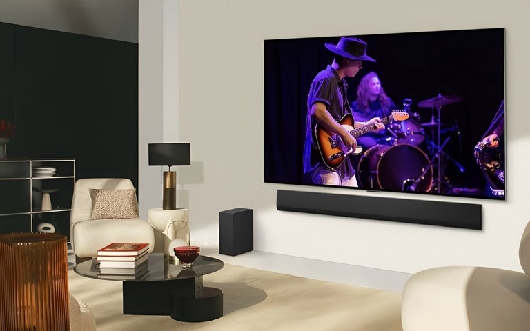 LG OLED TV and soundbar showing a live music performance. Perfect for gaming with top sound and picture quality.