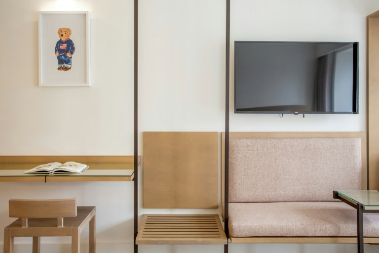 Maximise space in small living rooms by wall-mounting the TV for a sleek and clutter-free look.