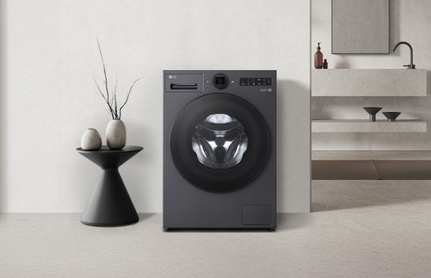 Eine LG-Waschmaschine und eine dekorative Vase stehen in der Nähe. Ein Produktzuschnitt ist in der unteren rechten Ecke des Bildes zu sehen.