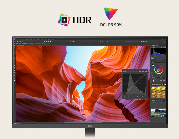 Front view of a white LG monitor displaying vivid canyon imagery with colour correction tools, highlighting HDR and 90% DCI-P3 colour coverage.
