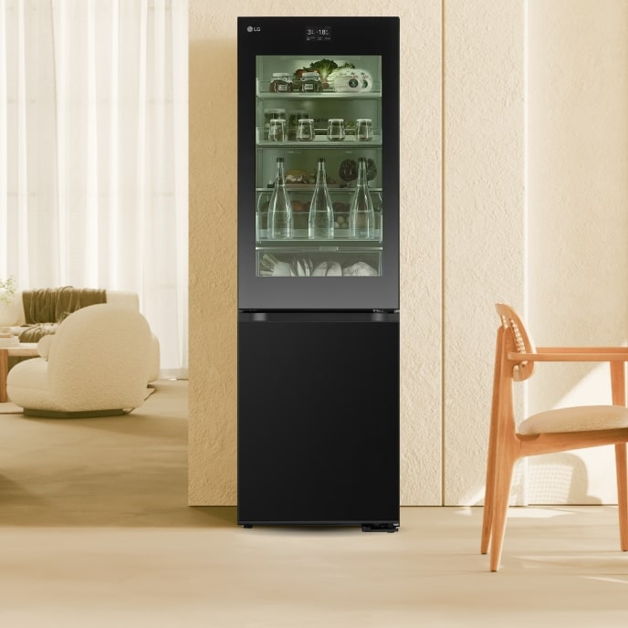 In a cozy beige-toned dining space, the LG InstaView refrigerator is placed with its mirror glass feature on.