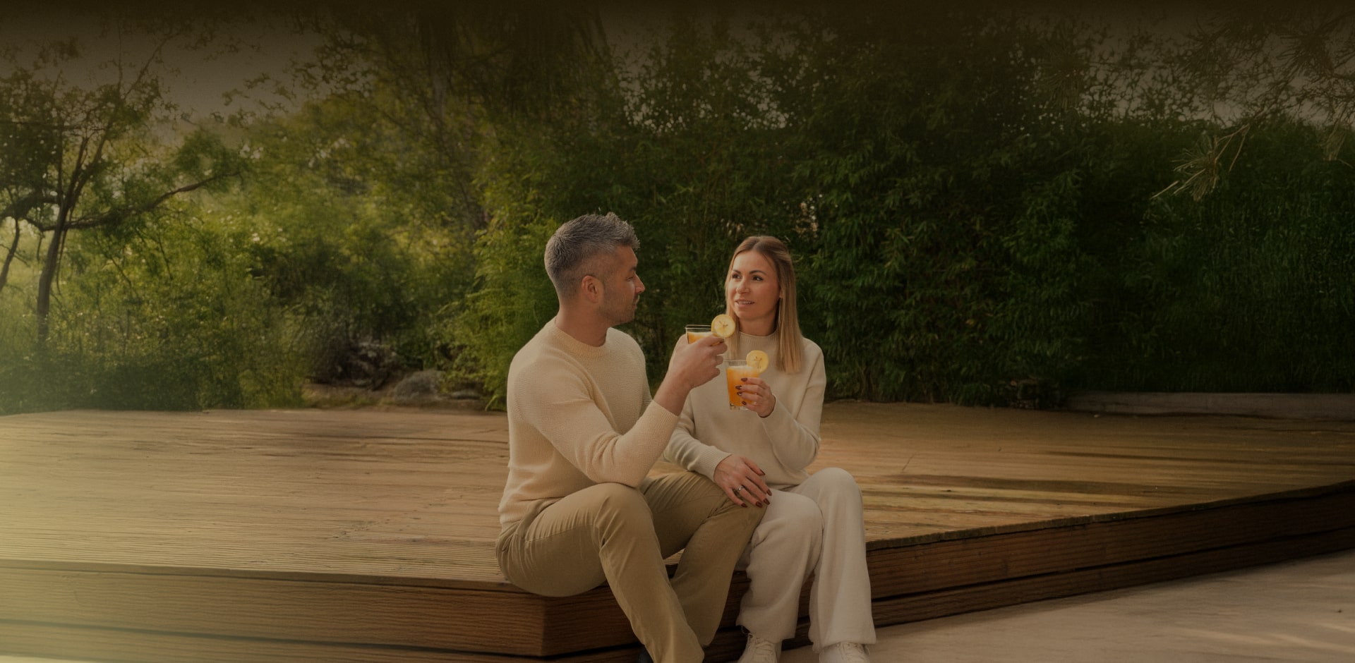 Couple enjoying outdoor tea with LG Washing Machine, promoting special moments for New Year resolutions 2025.