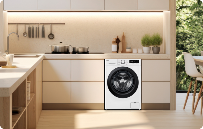 LG washing machine integrated into a contemporary kitchen with sleek cabinets.