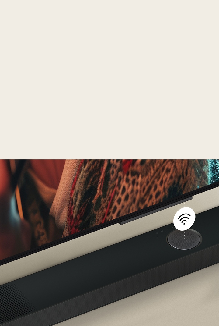 Close up of LG TV above a LG Soundbar with a WIFI symbol floating on top.