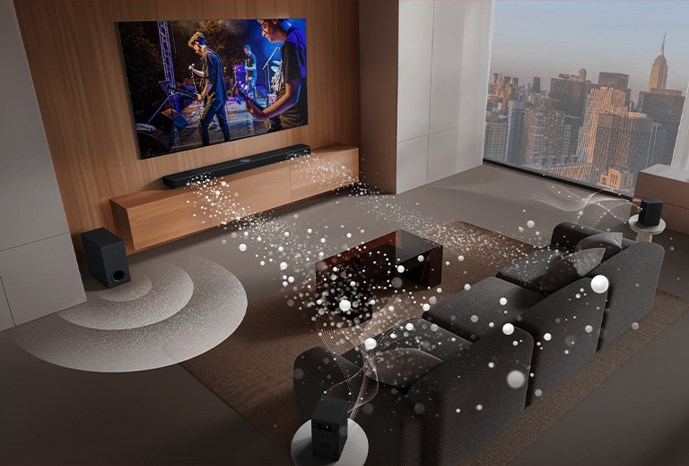 LG Soundbar, LG TV, rear speakers and a subwoofer are in a living room of a skyscraper, playing a musical performance. White soundwaves made up of droplets project from the soundbar and a subwoofer is creating a sound effect from the bottom.