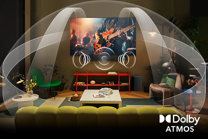 Dimly lit, cozy living room with an OLED LG TV with LG Soundbar. On the screen is a close-up of an electric guitar being played. Graphics show how Dolby Atmos fills the whole space with surround sound from all directions. Dolby Atmos logo is at the bottom corner.