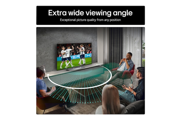 Living room space with a wall-mounted LG OLED TV. On the TV is a mountain range against a dark evening sky filled with stars. This scene is split in half. One side shows a duller, grayer version of the landscape labeled, Non Perfect Black display. On the other side is a more pleasing picture with a larger dynamic range of blacks and whites.