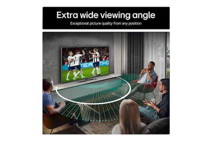 Living room space with a wall-mounted LG OLED TV. On the TV is a mountain range against a dark evening sky filled with stars. This scene is split in half. One side shows a duller, grayer version of the landscape labeled, Non Perfect Black display. On the other side is a more pleasing picture with a larger dynamic range of blacks and whites.