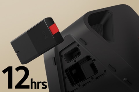 Rear side of Stage 301 is shown with its battert part open. A replaceable battery is hanging on the air right next to the xboom Stage 301.