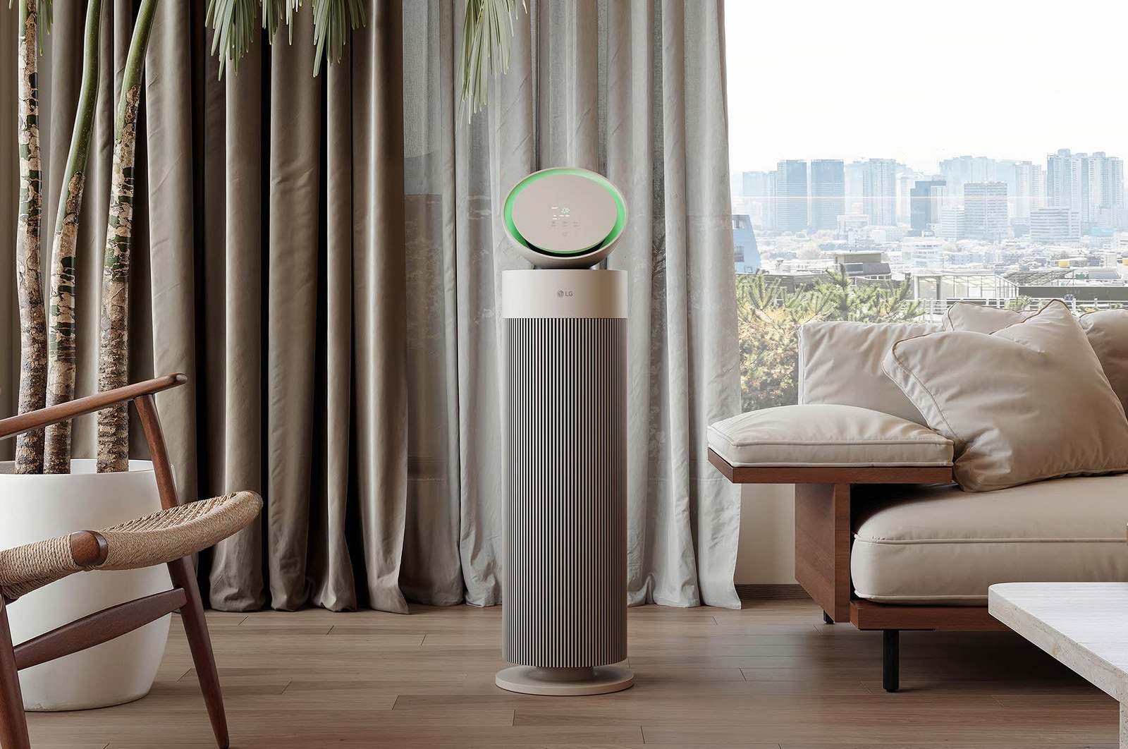 LG air purifier placed in a stylish living room with a beige sofa, dark bookshelf, and modern décor