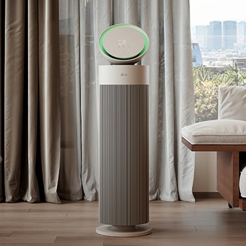 LG air purifier placed in a stylish living room with a beige sofa, dark bookshelf, and modern décor