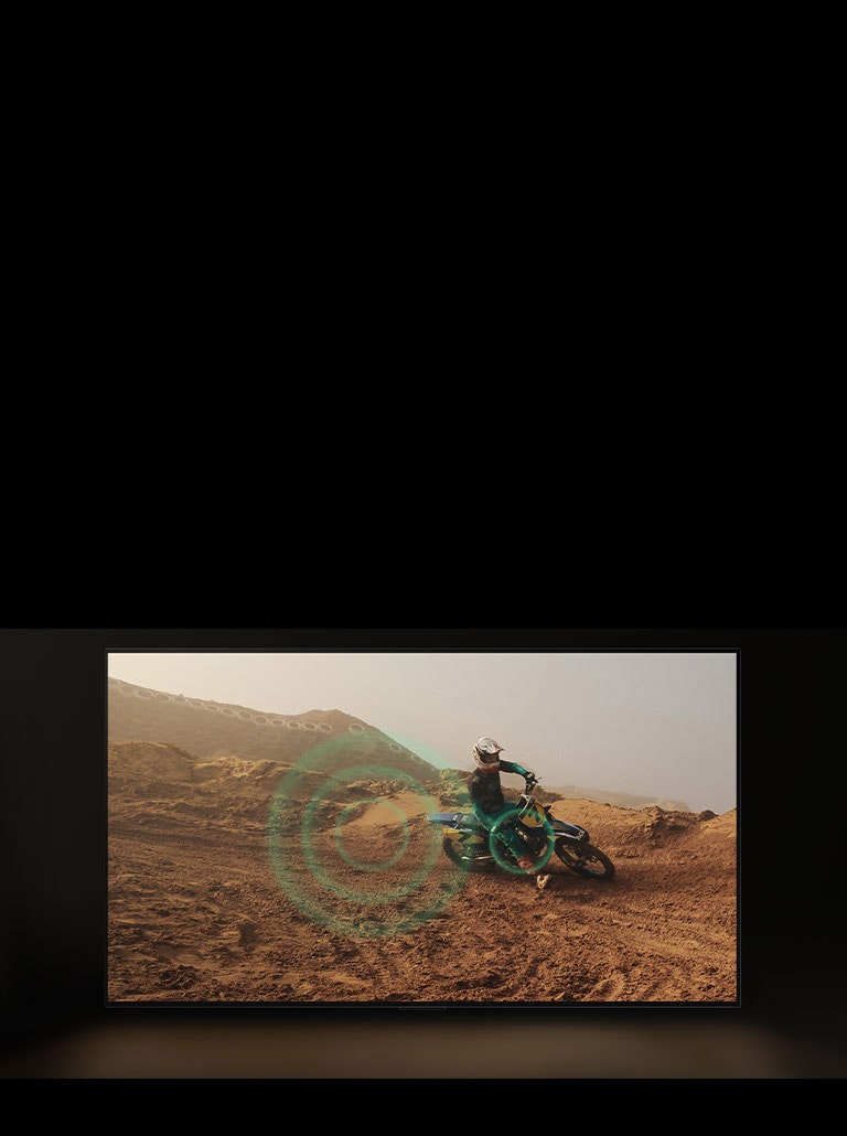 Video quay cảnh một người đạp xe địa hình trên vùng đất đỏ bụi bặm. Khi họ vào cua, bong bóng âm thanh màu xanh lá cây xuất hiện từ bánh xe. 