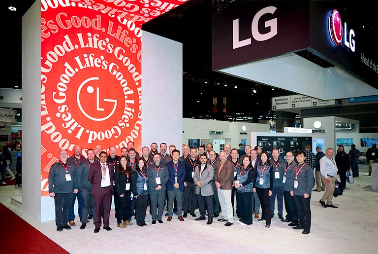 A group of LG employees who participated at AHR EXPO in Chicago posing for a photo.