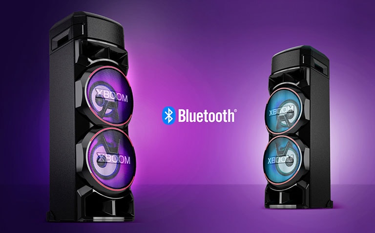 Two LG XBOOMs facing each other at diagonal angles against a purple background with a Bluetooth logo in between.