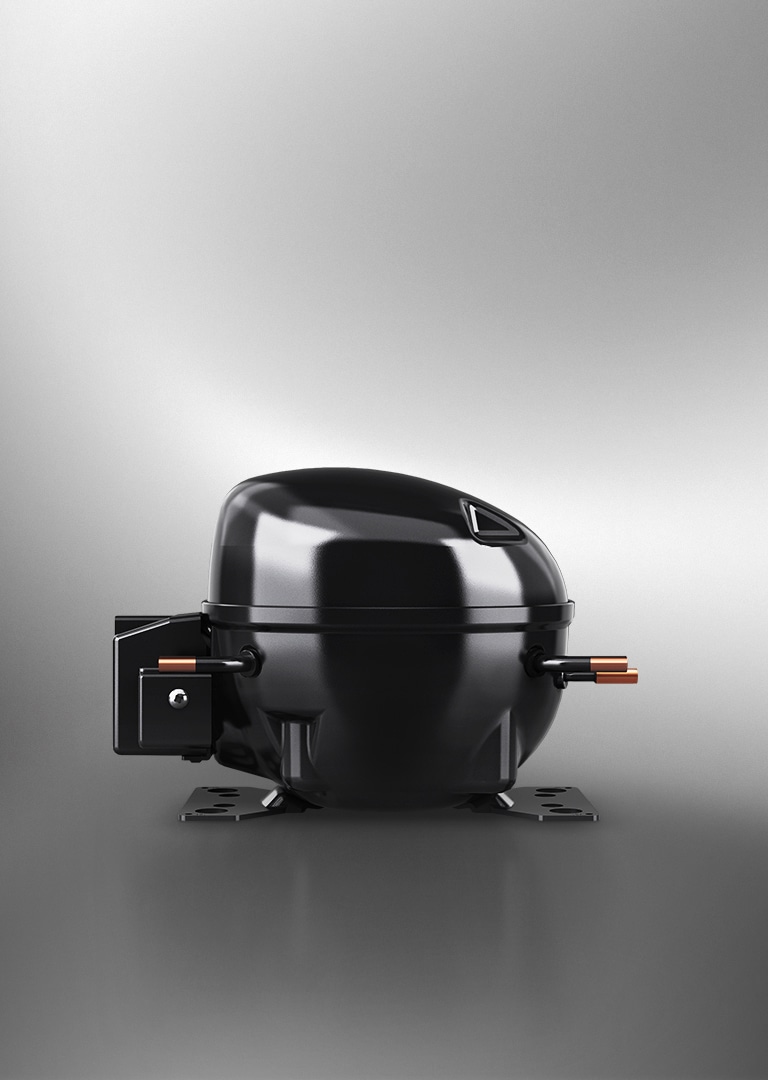 LG's fixed speed reciprocating compressor in black with metallic accents is highlighted under lighting.