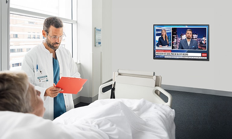 An LG commercial TV is installed in a hospital room.