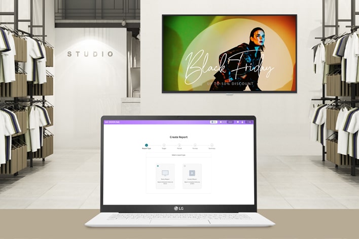 This image shows a laptop screen featuring LG DOOH Ads' Reports.