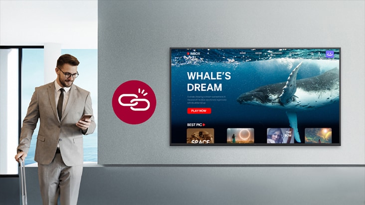 A man is checking out while OTT content is playing on the hotel room TV. The image illustrates a scenario related to the local PMS feature that supports automatic logout upon checkout.