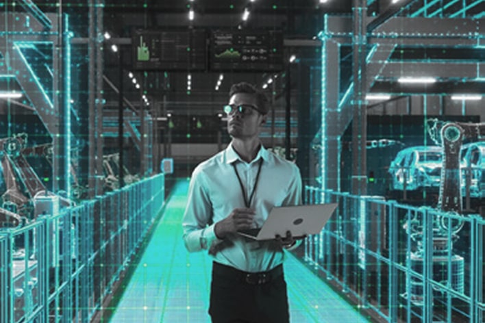 Factory technician monitoring equipment health via LG digital dashboard for predictive maintenance and efficient management