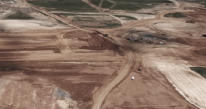 Aerial view of construction site for smart factory location and health check for site selection