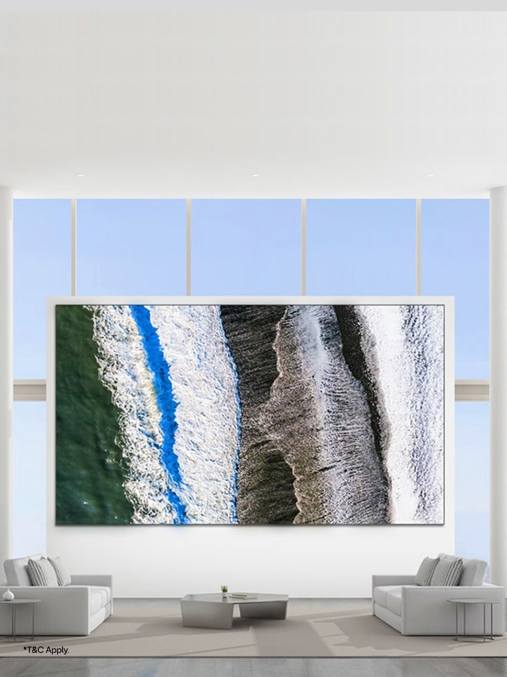 LG MAGNIT microLED display presents immersive large-scale visuals in a premium living room environment with full-height windows and modern décor