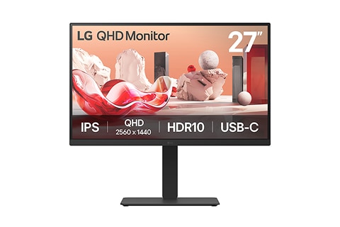 Desktop monitor with a slim stand displaying an abstract scene featuring soft red and white shapes and spheres, shown against a plain light background.
