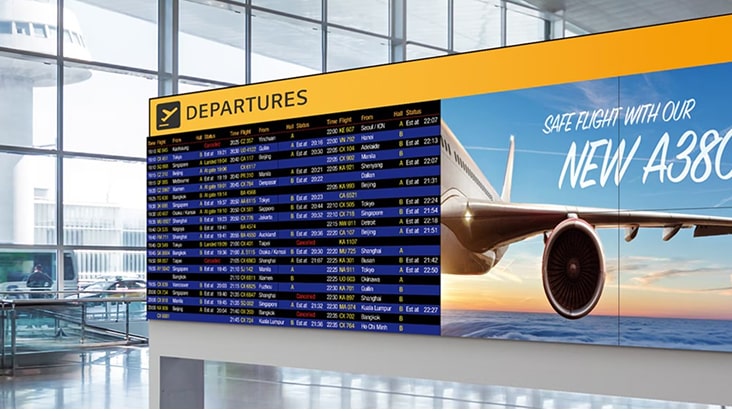 LG Video Wall installed in an airport displaying real-time flight departure information.
