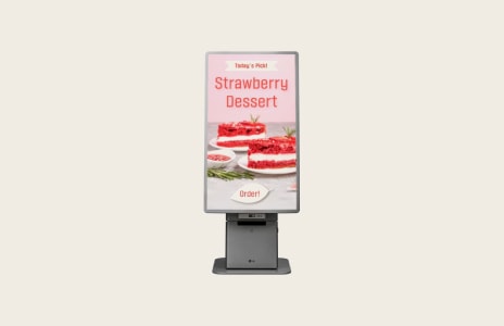 LG digital kiosk promoting a strawberry dessert menu within a retail environment.