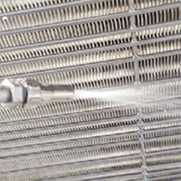 The Heat Exchanger fin is being cleaned with water.