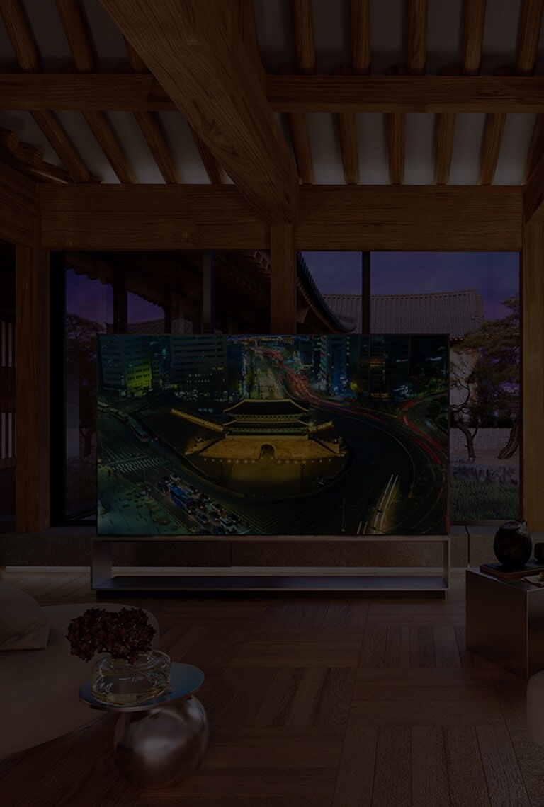 LG SIGNATURE OLED 8K TV is placed in the living room of Hanok, Korean traditional house, with a city backdrop of Seoul.