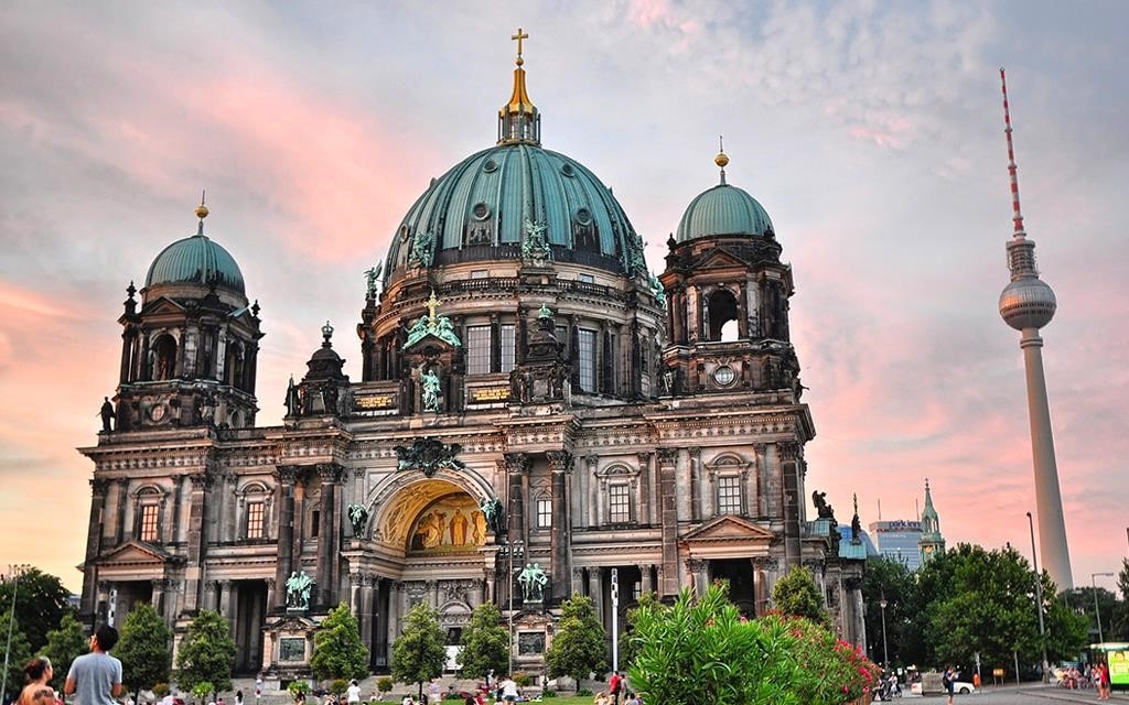 Travel Berlin: The Berlin Cathedral at sunset, with the TV tower in the background.