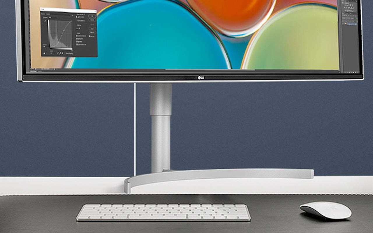 A keyboard and mouse compliment an ergonomic workstation.